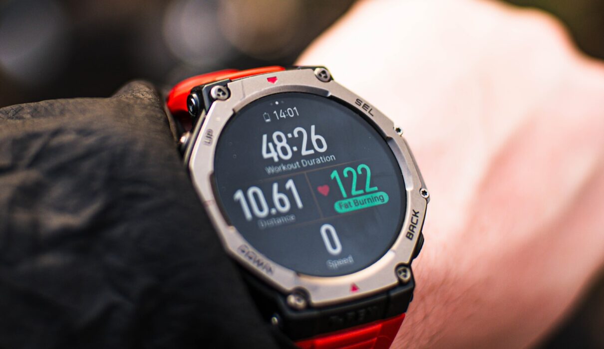 Person checking a fitness tracker during a workout