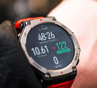 Person checking a fitness tracker during a workout