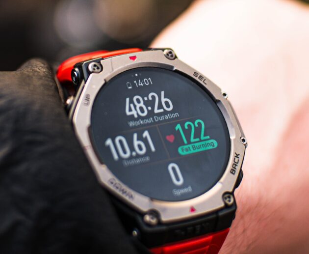 Person checking a fitness tracker during a workout