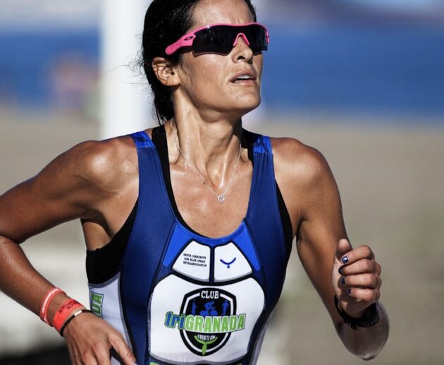 Endurance athlete running in training kit, the interval training a heart rate monitor chest strap is built for