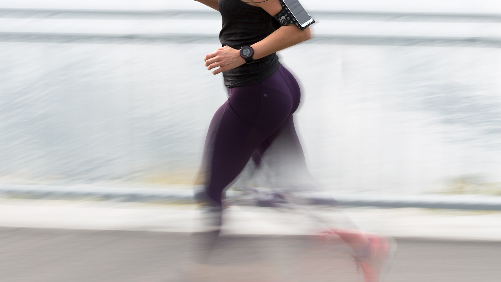 Runner training outdoors with heart rate monitoring