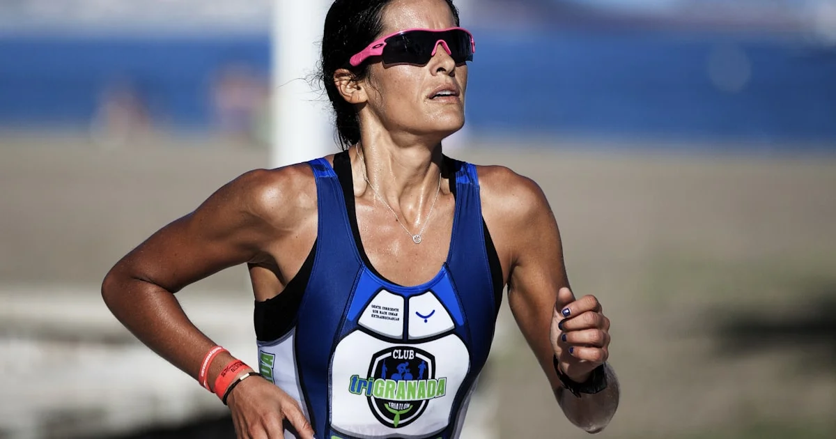 Endurance athlete running in training kit, the interval training a heart rate monitor chest strap is built for