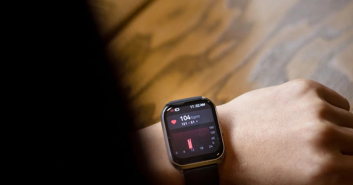 A square smartwatch on a wrist showing a heart rate reading, the everyday view from the best smartwatch for fitness
