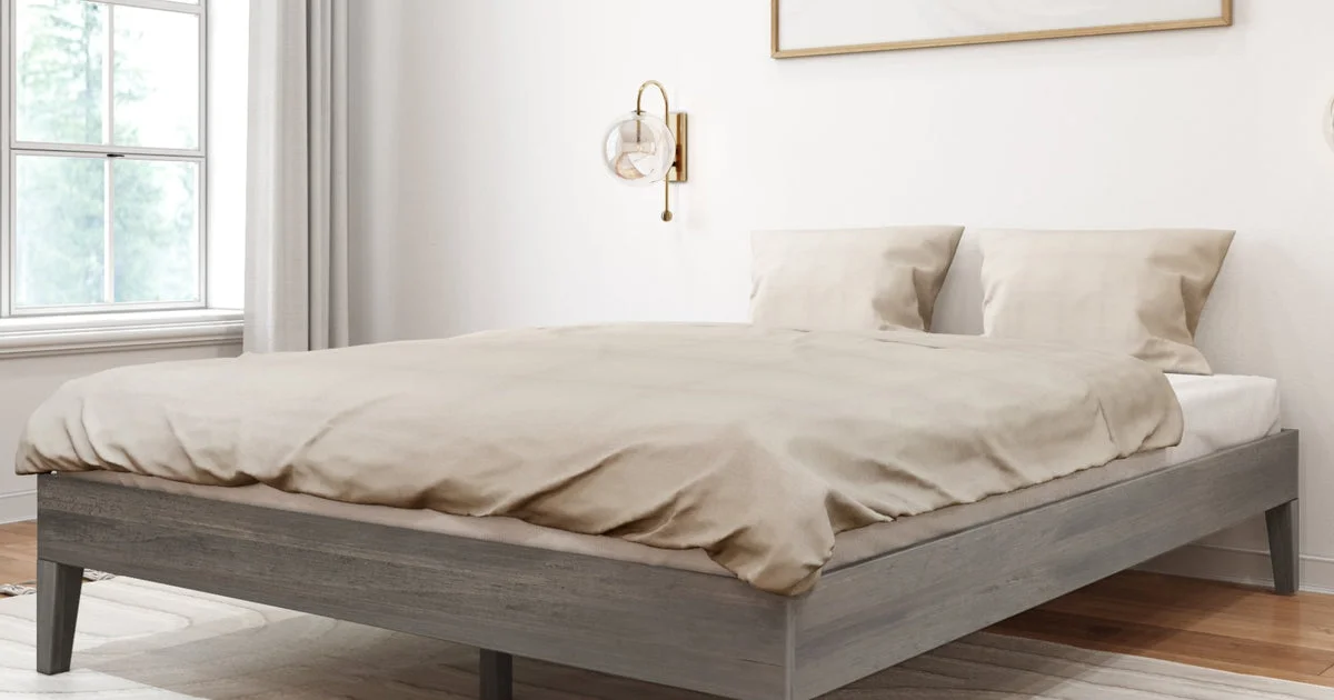 A low Plank+Beam platform bed with no headboard, a solid wood bed frame for small bedrooms, set under a window